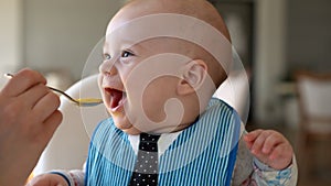 Childhood, Happiness, family, Motherhood. Cheerful happy smiling baby Close up face. Emotions of newborn boy. child in a