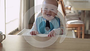 Childhood, Happiness, family, otherhood. Cheerful happy smiling baby Close up face. Emotions of newborn boy. child in a