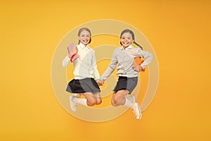 Childhood happiness. Schoolgirls tidy appearance school uniform. School friendship. September again. School day fun