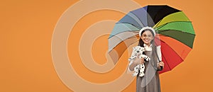 childhood happiness. teen child under colorful parasol. kid in beret with rainbow umbrella.