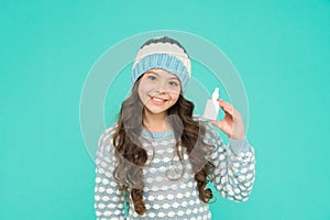 childhood healthcare. teen girl with nasal spray. no addiction to medicals. kid in warm sweater photo