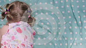 Childhood. Little Girl Lying And Laughing Closeup