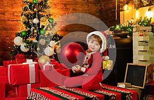 Childhood memories. Santa boy little child celebrate christmas at home. Family holiday. Boy child play near christmas