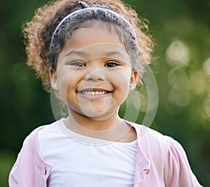 Childhood is the most beautiful of all lifes seasons. Portrait of an adorable little girl having fun outdoors.