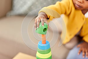 Close up of african baby playing toy blocks