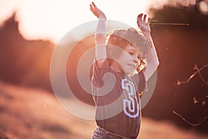 Childhood - Playing on the filed in sunset