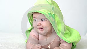 Childhood, daily routine, hygiene infant concepts - Close-up Happy kid colored towel of green frog on white background