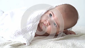 Childhood, daily routine, hygiene infant concepts - Close-up Happy kid towel on white background after taking bath