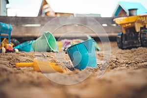 Childhood sandbox concept: Close up of plastic toy bucket