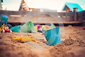 Childhood sandbox concept: Close up of plastic toy bucket photo