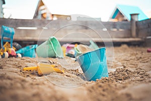 Childhood sandbox concept: Close up of plastic toy bucket photo