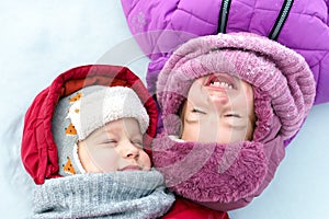 Childhood, snowy time, winter holidays cold weather. Close up portrait little preschool happy Children boy girl face