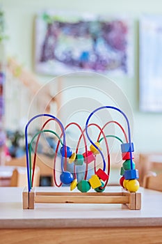 Childhood and socialization concept: Colorful wooden toy in the kindergarten
