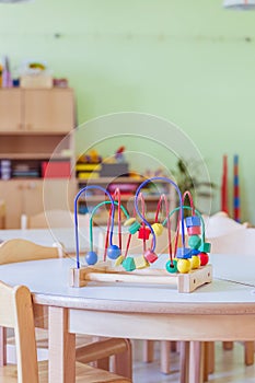 Childhood and socialization concept: Colorful wooden toy in the kindergarten