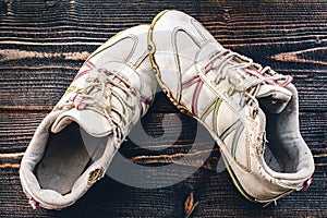 Childhood symbol - pair of vintage used teenage sneakers