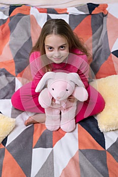 childhood of teen girl relax wearing pajama holding toy. childhood of teen girl relax.