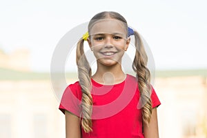 From childhood to girlhood. Happy child smile outdoors. Happy childhood. Enjoying childhood years. Childhood protection photo