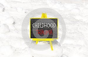Childhood trauma symbol. Concept words Childhood trauma on beautiful black chalk blackboard. Chalkboard. Beautiful snow background