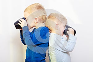 Childhood. Two brothers little boys drinking tea