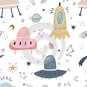 Childish seamless pattern with aliens, ufo in cosmos. Perfect for kids apparel,fabric, textile, nursery decoration,wrapping paper photo