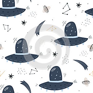 Childish seamless pattern with aliens, ufo in cosmos. Perfect for kids apparel,fabric, textile, nursery decoration,wrapping paper photo