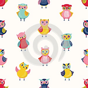 Childish seamless pattern with cute wise owls on white background. Backdrop with cartoon forest birds in different