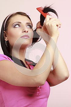 Childish woman infantile girl combing hair