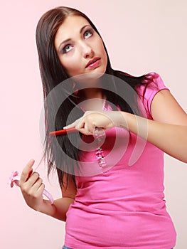 Childish woman infantile girl combing hair