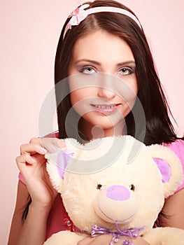 Childish woman infantile girl hugging teddy bear