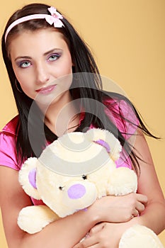 Childish woman infantile girl hugging teddy bear