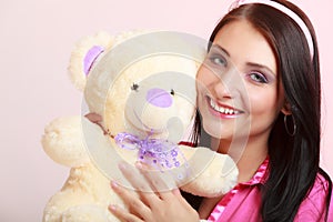 Childish woman infantile girl hugging teddy bear