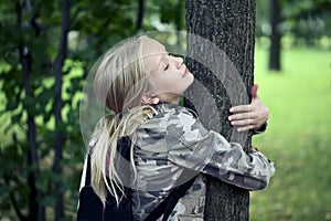 Childn embracing tree. Environmental protection outdoor nature. Conservation outdoors