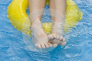 Childre in paddling pool photo