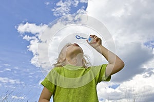 Childrem blowing bubbles