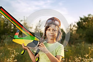 Children with airplan toy outdoors