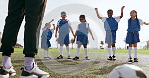 Children, arm warm up and sport on soccer field with coach for training and school fitness. Youth, kids and workout for