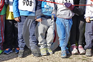 Children athletics runner on a cross country race. Start