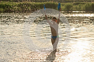 Children bathe in the evening on the city beach photo