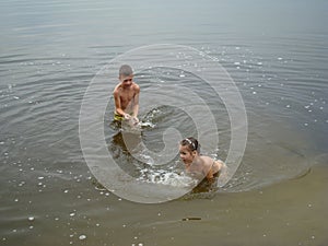 Children bathing in the river