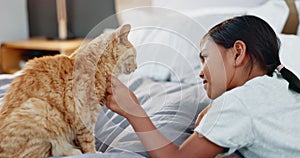Children, bed and a girl petting her cat in the morning for bonding in a home with love, trust or care. Kids, bedroom