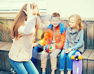 Children on bench playing children`s games