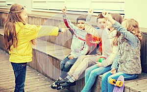 Children on bench playing children`s games