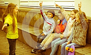 Children on bench playing children`s games