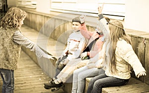 Children on bench playing children`s games