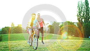 Children in bicycle helmet go on hill walk bike