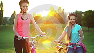 Children in bicycle helmet go on hill walk bike