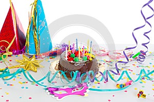 Children birthday party with chocolate cake