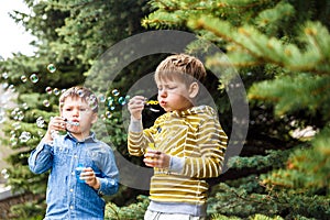 Children blow bubbles