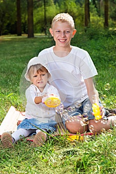 Children blow bubbles