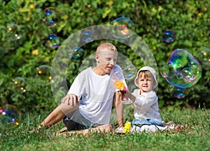 Children blow bubbles